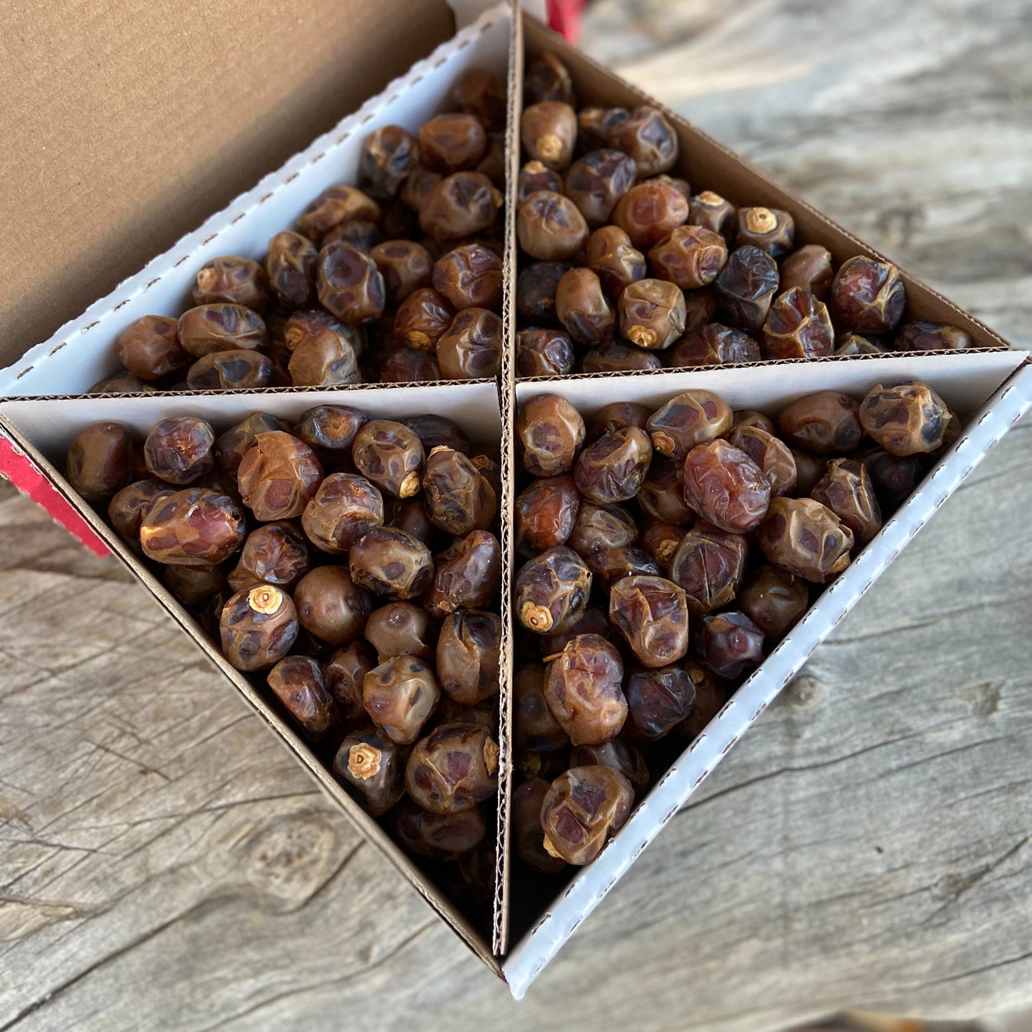 Brown Barhi Dates in a bo with four sections